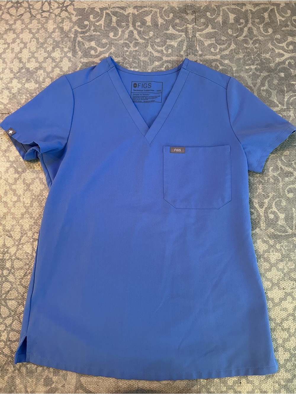 FIGS Technical Collection V-Neck Scrub Top in Ceil Blue